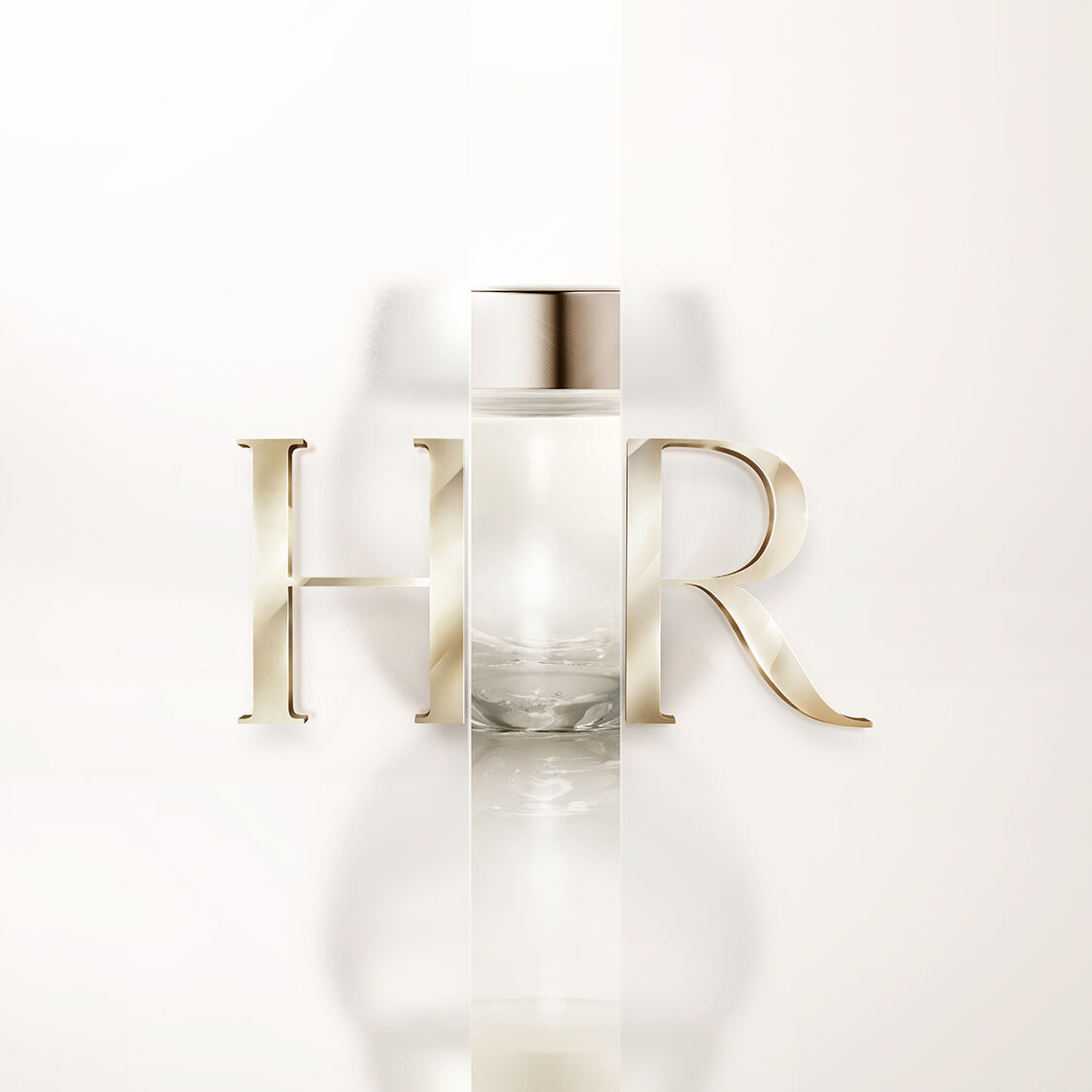 Frasco transparente Helena Rubinstein con logo HR dorado en fondo blanco.