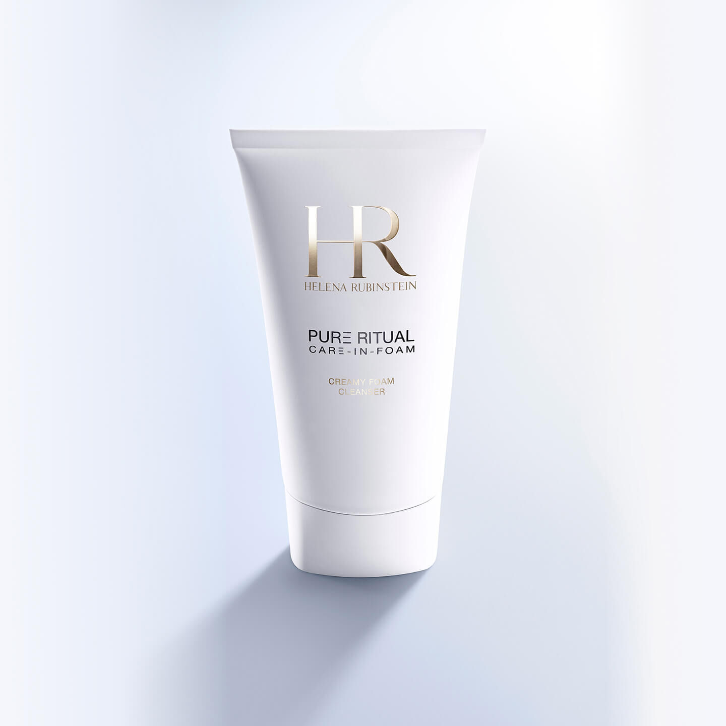 Imagen frontal del envase de Helena Rubinstein Pure Ritual Care-in-Foam sobre un fondo azul.