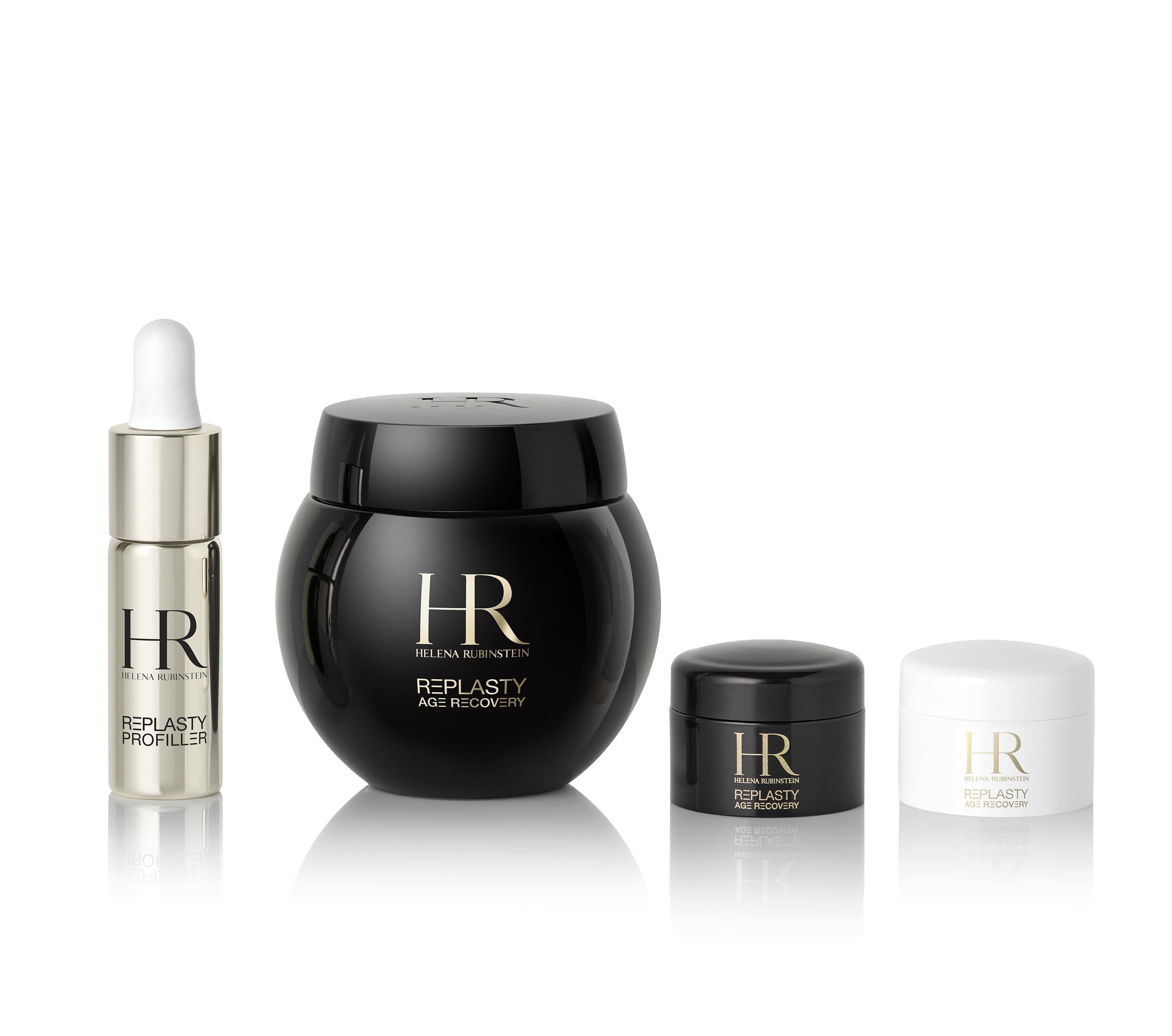 Cuatro productos Helena Rubinstein "Re-Plasty Age Recovery": un frasco cuentagotas, un tarro negro grande, un tarro negro pequeno y un tarro blanco pequeno. Presentacion elegante sobre fondo blanco reflectante.